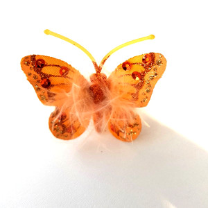 Motýlek na klipu 5 cm sv.oranžový s peříčky